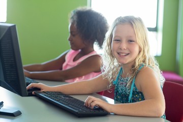 Sticker - Happy girl with classmate using computers