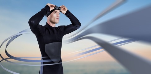 Poster - Composite image of swimmer in wetsuit wearing swimming goggles