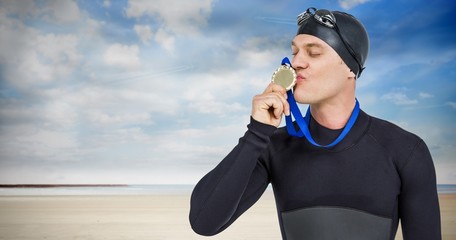 Poster - Composite image of swimmer kissing his gold medal