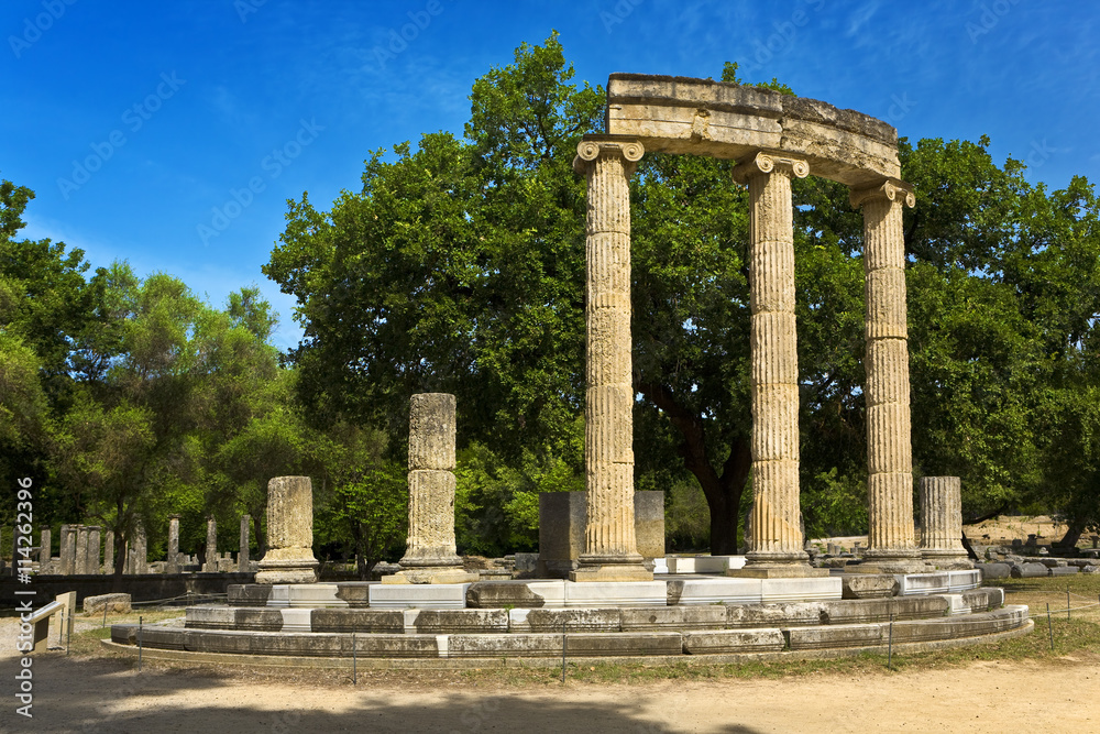 Greece. Archaeological Site of Olympia. Ruins of the Philippeion (4rth century BC). The archaeological site of Olympia is on UNESCO World Heritage List since 1989 - obrazy, fototapety, plakaty 