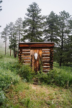 Log Cabin With Animal Skull On Door