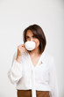 © Cookie Studio - Portrait of young successful business woman over white backgroun