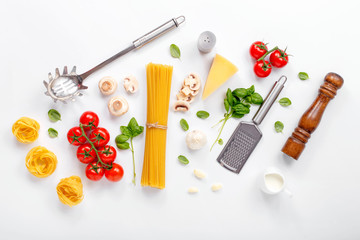 Wall Mural - Fettuccine and spaghetti with ingredients for cooking pasta