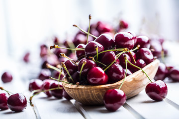 Wall Mural - Cherries. Sweet Cherries. Fresh Cherries. Ripe cherries on wooden concrete table - board.