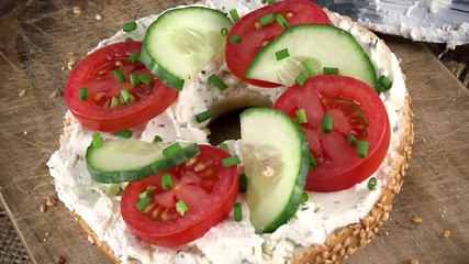 Poster - Bagels with Cream Cheese and vegetables (rotating, close-up) as not loopable 4K UHD footage