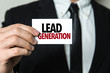 © gustavofrazao - Business man holding a card with the text: Lead Generation