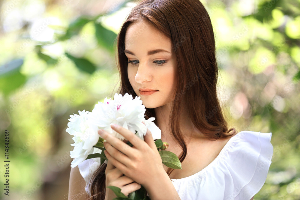 Portrait of beautiful girl with flowers