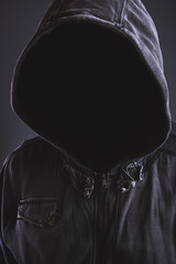 Poster - Unrecognizable hooded soccer hooligan portrait