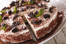 Cheesecake With Chocolate Cookies Decorated With Mint Closeup. Horizontal
