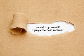 Invest In Yourself Quote Ripped Paper Concept