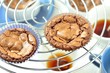 © tktyfy - freshly baked chocolate muffins cooling off on wire mesh
