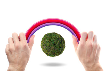 abstract green planet on a white background under a rainbow
