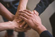 © thanatphoto - Unit and concord in multiethnic team, all hands together