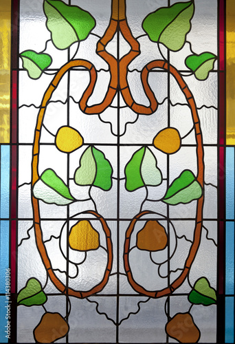 Fototapeta na wymiar Colorful stained glass with floral motifs