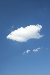 Wall Mural - Single white cloud in the blue sky
