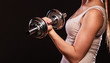© Voyagerix - athletic woman working with heavy dumbbells