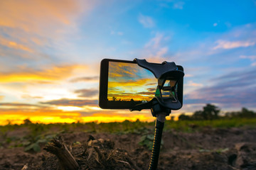 Wall Mural - mobile phone shooting photo and time-lapse beautiful color sunse