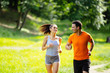 © NDABCREATIVITY - Healthy couple jogging in nature