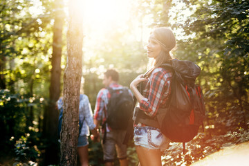 Wall Mural - people trekking in forest