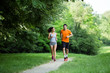 © NDABCREATIVITY - Athletic couple jogging in nature