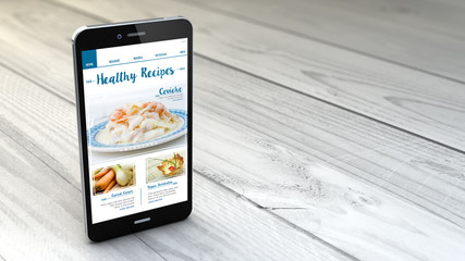 Wall Mural - smartphone over white wooden background showing healthy recipes