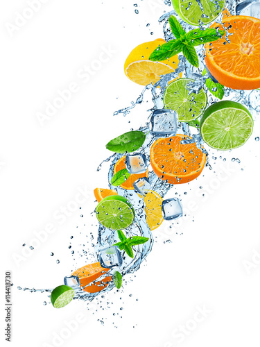 Fototapeta do kuchni Fresh fruit in water splash over white