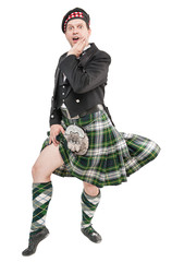 Wall Mural - Scottish man in traditional national costume with blowing kilt