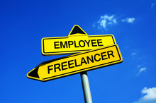Employee Or Freelancer - Traffic Sign With Two Options - Decision Between Independent And Insecure Freelance Or Employment. Self-employment Vs Work Under Boss