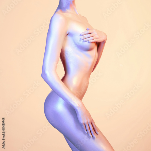 Stampa su Tela Elegant nude model in the light colored spotlights