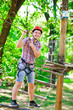 © davit85 - adventure climbing high wire park - people on course in mountain