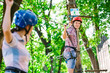 © davit85 - adventure climbing high wire park - people on course in mountain