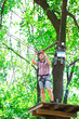 © davit85 - adventure climbing high wire park - people on course in mountain