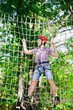 © davit85 - adventure climbing high wire park - people on course in mountain