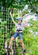 © davit85 - adventure climbing high wire park - people on course in mountain
