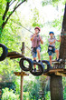 © davit85 - adventure climbing high wire park - people on course in mountain
