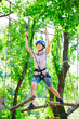 © davit85 - adventure climbing high wire park - people on course in mountain