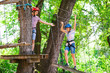 © davit85 - adventure climbing high wire park - people on course in mountain