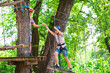 © davit85 - adventure climbing high wire park - people on course in mountain