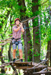 © davit85 - adventure climbing high wire park - people on course in mountain