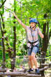 © davit85 - adventure climbing high wire park - people on course in mountain