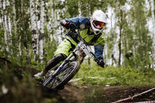 Closeup Man Athlete Mountain Biking Around Sharp Turn In Forest During Competition Downhill