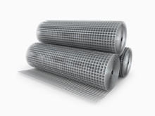 Galvanized Welded Wire Mesh Twisted Into A Roll On A White Backg
