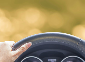 hand of woman driving car