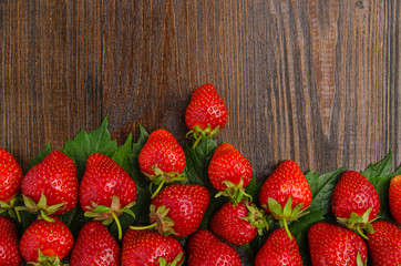 Wall Mural - Many tasty strawberries on old wooden background