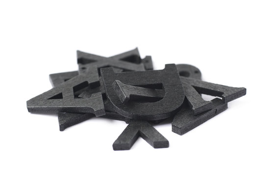 Pile of painted wooden letters isolated