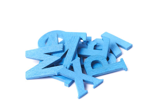 Pile of painted wooden letters isolated