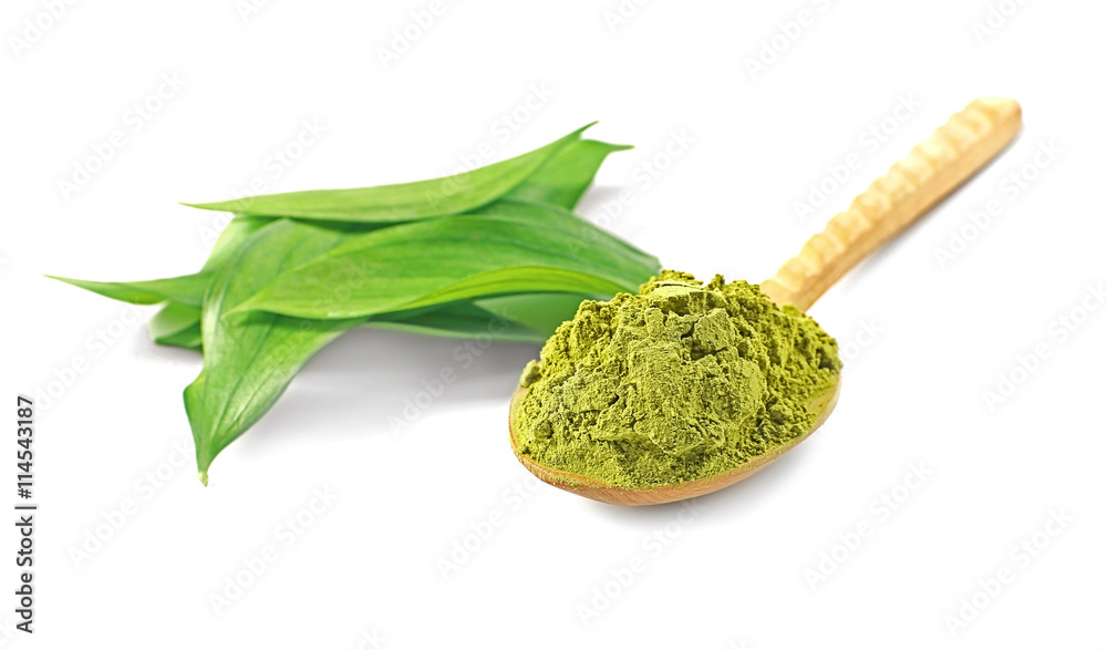 Wooden spoon with powdered matcha green tea, isolated on white