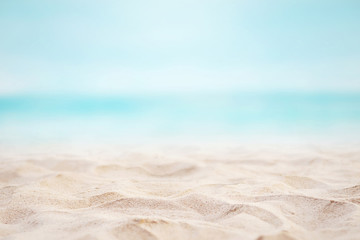 close up sand with blurred sea sky background, summer day, copy space or for product. summer backgro