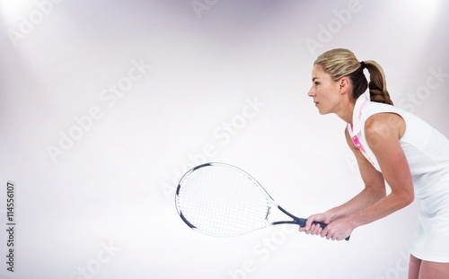 Cuadros en Lienzo Composite image of athlete playing tennis with a racket