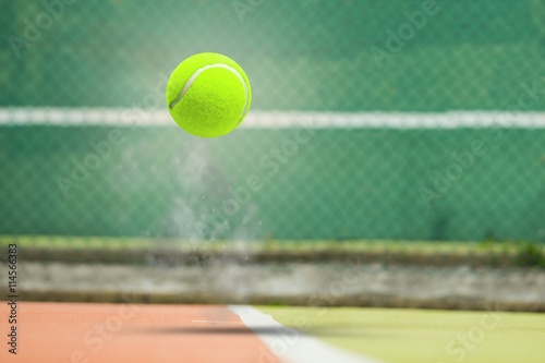Composite image of tennis ball with a syringe Poster